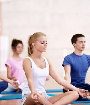 Young attractive people do yoga